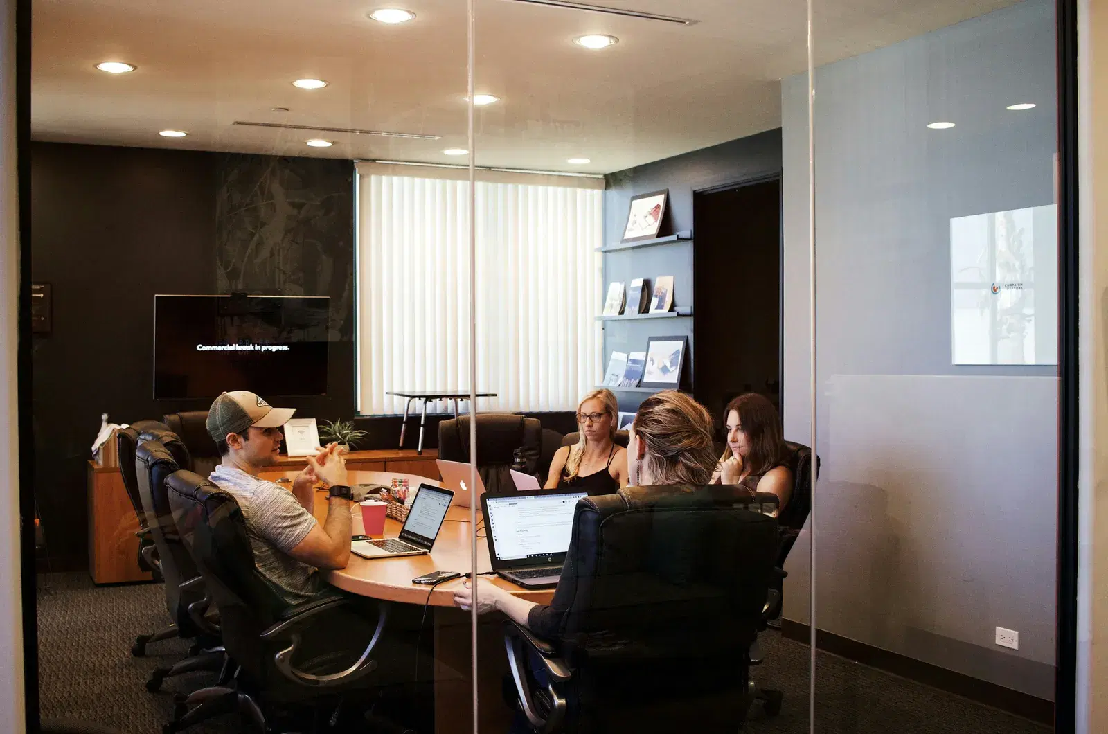A team discussing a campaign in a meeting room